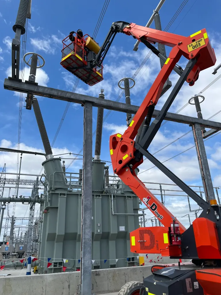 Mega Power Services electricians working from an elevated work platform at a Sydney high-voltage substation
